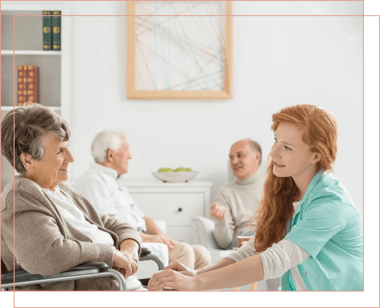 A caregiver holds hands with an elderly woman, sharing a warm moment.