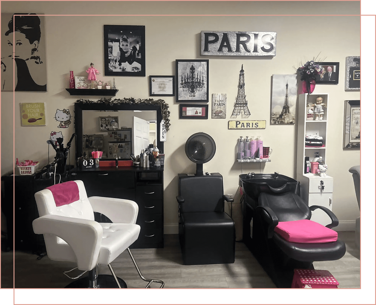 Cozy salon corner with stylish Paris-themed decor and comfortable chairs.